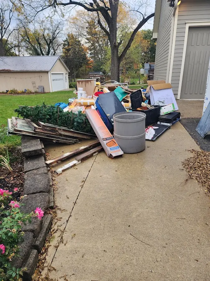 Dumpster being loaded with debris for Commercial Dumpster Rental in Lynnwood
